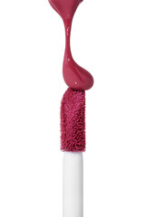 Red drop liquid lipstick falls on applicator. Closeup shot of colorful brush liquid lipstick