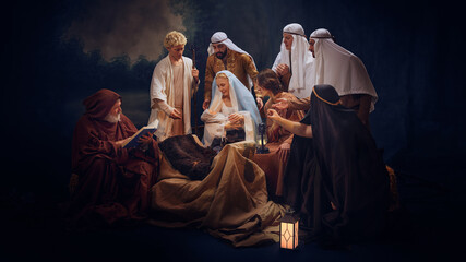 Nativity scene with Mary, Joseph, shepherds and angel around baby Jesus in a manger, Traditional...