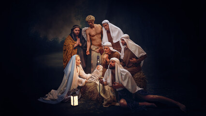 Classic Nativity scene showing Mary, abys Jesus and shepherds in traditional costumes. Celebration...