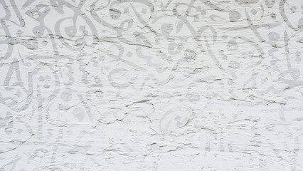 Arabic calligraphy wallpaper on a white wall with a black interlocking background subtitles...