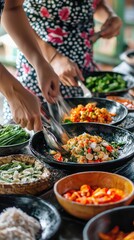 Obraz premium A vibrant spread of fresh ingredients as people prepare a delicious, colorful meal together in a lively kitchen setting.