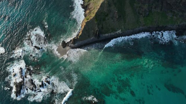 Aerial footage of Lord Howe island from North end looking down to the water
