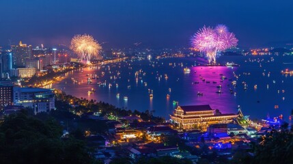 Obraz premium The vibrant Pattaya International Fireworks Festival, lighting up the night sky over the bay.