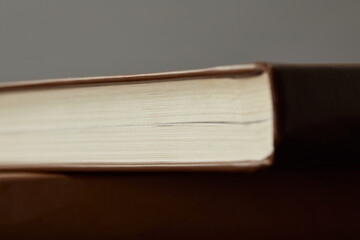 A close-up of a well-worn book reveals the journey of knowledge in a quiet study nook, inviting contemplation.