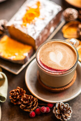 Christmas background with chai latte and homemade carrot cake. Christmas table.