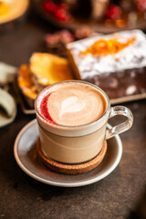 Christmas background with chai latte and homemade carrot cake. Christmas table.