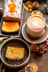 Christmas background with chai latte and homemade carrot cake. Christmas table.