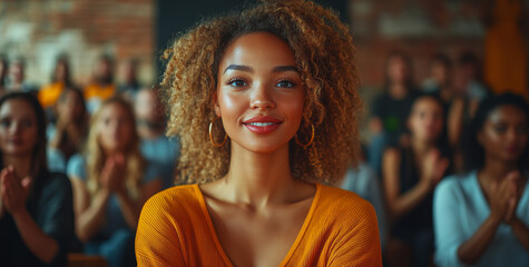 Obraz premium Happy, diverse business people clapping and sitting in chairs at a conference or presentation, while a female speaker is presenting her ideas to the audience during a corporate workshop event. 