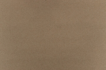 Plain brown cardboard with visible surface texture and slight variations in color