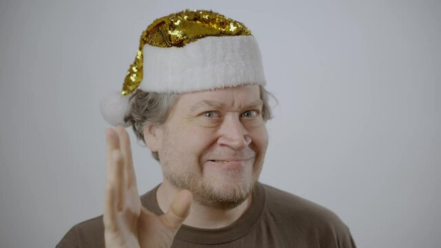 cranky man in christmas hat