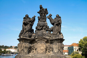 Front view of the sculptural group depicting the Madonna with Saint Dominic and Saint Thomas Aquinas, on the Charles Bridge in Prague