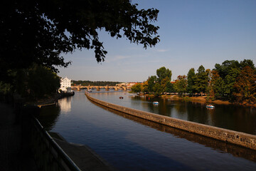 Fototapeta premium View of the Vltava River in Prague, Charles Bridge in the background.