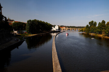 View of the Vltava River in Prague, Charles Bridge in the background.