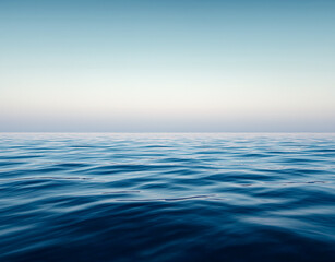 Obraz premium Calm sea under a blue sky at sunrise. waterline. sea water surface. mockup. product display. minimalistic bacground