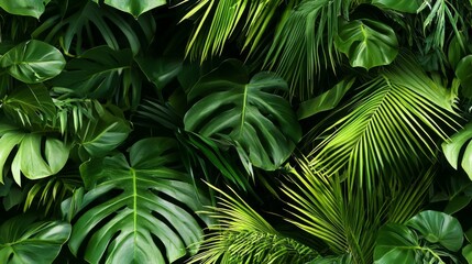 Tropical foliage featuring palm leaves and exotic plants. Vibrant green wallpaper seamless pattern