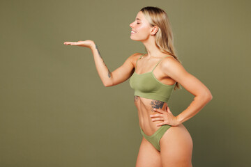 Young nice lady woman with slim skinny body perfect skin wear top bra lingerie stand hold empty...