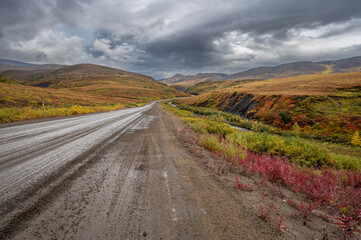 Wet Dempster Highway in a valley of the Richardson Mountains of Northwest Territories, Canada