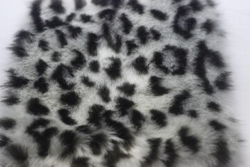 photo of synthetic material with fur in leopard motifs for industrial purposes