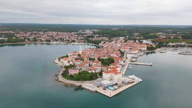 Aerial drone video of the coastal town named Porec in Istria, Croatia.