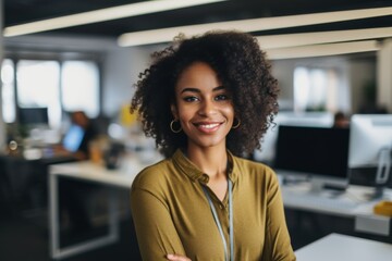 Smiling portrait of a young hipster African American woman in office