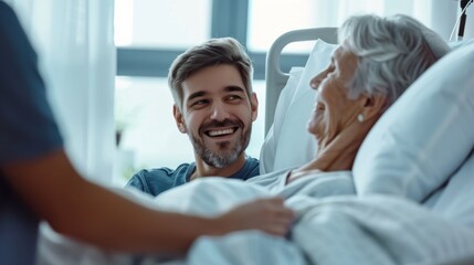 Obraz premium A man is smiling at a woman in a hospital bed