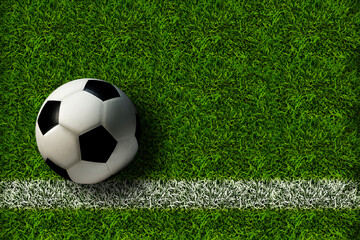 A football ball on the green lawn