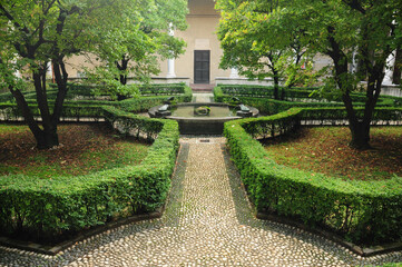 Milan, Lombardy, Italy. October 25, 2010: A beautifully landscaped garden with neatly trimmed...