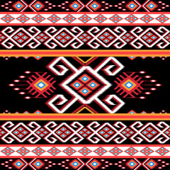 Bold ethnic Ikat pattern featuring red, white, and gold geometric shapes with diamond and heart motifs on a black background. Ideal for fabric design, home decor, and fashion with a tribal-inspired 