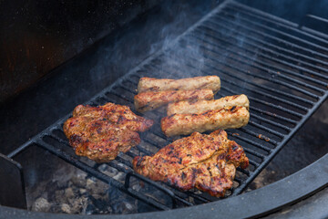 Different types of meat on the outdoor grill