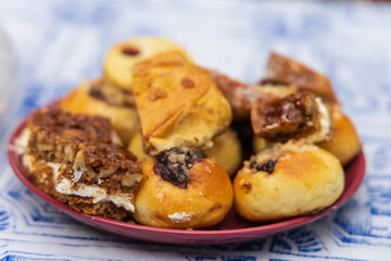 Tiny baked cookies on a plate at a party