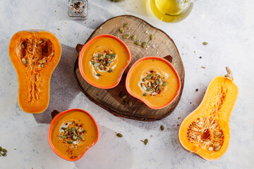 Traditional autumn butternut squash soup with seeds.