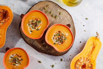Traditional autumn butternut squash soup with seeds.