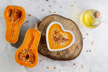 Traditional autumn butternut squash soup with seeds.
