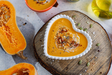 Traditional autumn butternut squash soup with seeds.