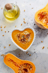 Traditional autumn butternut squash soup with seeds.