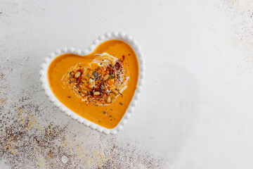 Traditional autumn butternut squash soup with seeds.