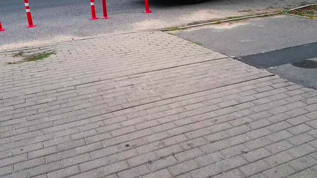 Slow motion footage of the interlock bricks of the pavement. Street
