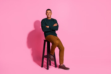 Full length photo of attractive funny guy wear sweatshirt sitting bar chair arms crossed emtpy...