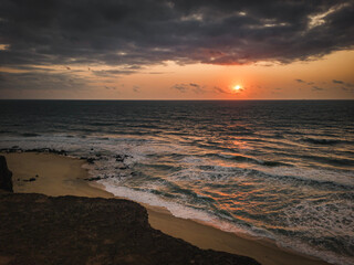 sunrise with clouds, Beach, blue sky, nature, mountain, cliffs, Tropical climate, Summer climate, Dramatic clouds - Photo in Praia da Pipa - RN, Brazil