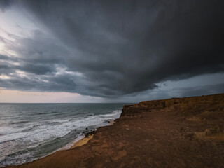 sunrise with clouds, Beach, blue sky, nature, mountain, cliffs, Tropical climate, Summer climate, Dramatic clouds - Photo in Praia da Pipa - RN, Brazil