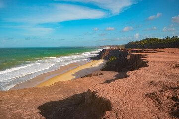 Beach seen from the top of the mountain, blue sky, nature, mountain, cliffs, Tropical climate, summer climate, beach day - Photo in Praia da Pipa - RN, Brazil