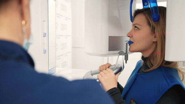 Modern technology of computed tomography in dental clinic, woman patient. X-ray machine for diagnosis dental disease, visiting of stomatology clinic, dental implantation and surgery, bite correction