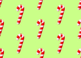 Seamless pattern with Christmas candies. New Year's candies in a white and red stripe. Candy cane. New Year's mood. Set with candies. New Year's pattern on a green background.