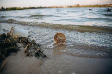 Trash on the shore, conception of the ecology and Earth day