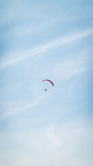 Person parachuting on a cloudy day