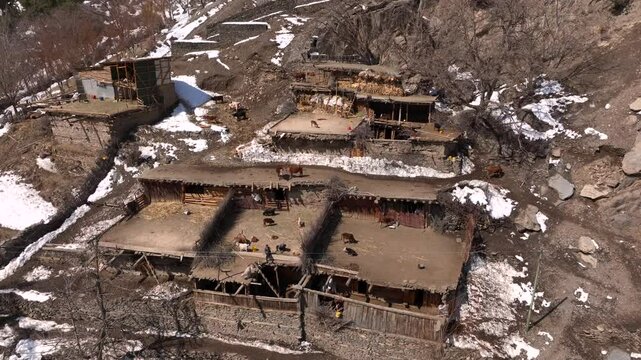 Scenic Kalasha Village in Bamburet Valley in North Pakistan at Winter. Aerial View Hindu Kush Muntain Range Himalayas.