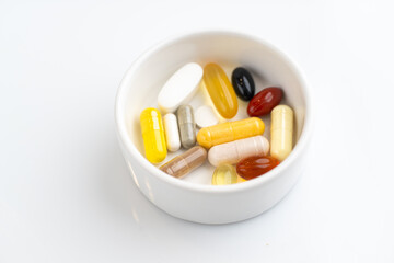 Close up of Small Dish with Various Vitamin Supplements