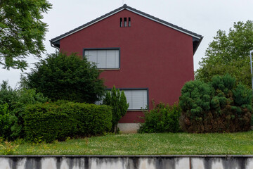 A red two-story house is for sale - Kaiserslautern, Germany 28.06.2024