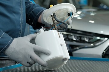 Car maintenance. The car mechanic conducts external control of the integrity and serviceability of...