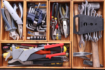 The tools are in wooden boxes.